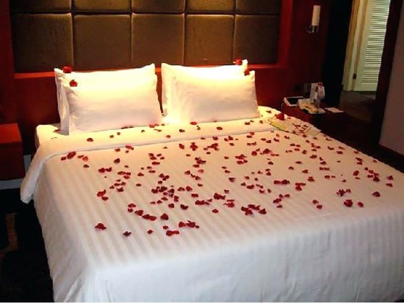 Candle And Red Roses