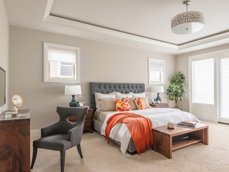 A Gray Tufted Bed