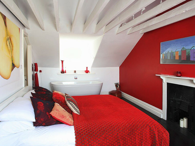 Versatile Red Bedroom With A Bathtub
