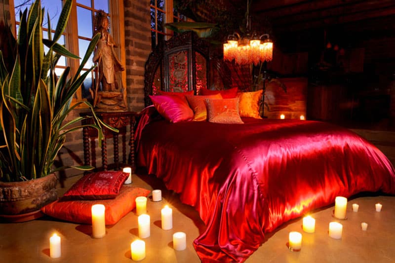 A Romantic Red Bedroom For Couples With Candles