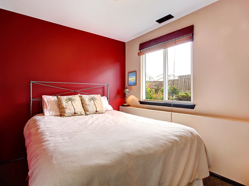Bedroom In Red And Cream Walls