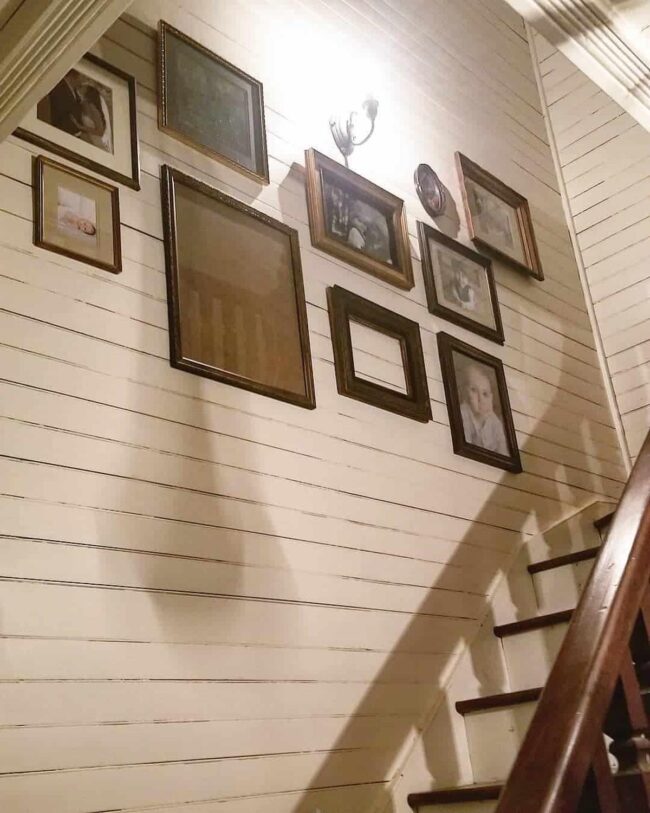 Vintage Portrait Frames as Stairwell Decor