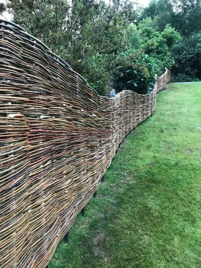 Woven Branch Fence Embraces Green Landscape
